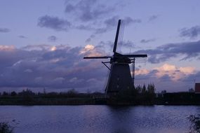 windmill at purple evening sky, netherlands