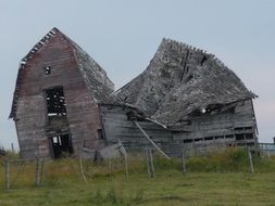 ruined building on a green hill