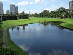 scenic park with pond in city, Philippines, metro manila