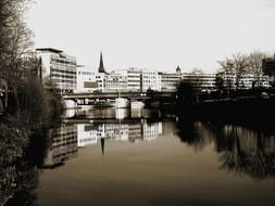 distant view of a city near the river in black and white image
