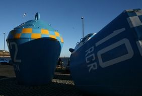 big blue buoys by the ocean