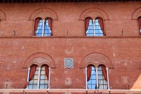 ornament near the windows on the facade of the building