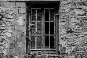 Dilapidated wall of a house in black and white