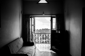 Old couch and french window in black and white