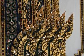 Golden jewelled interior in buddhist religion temple