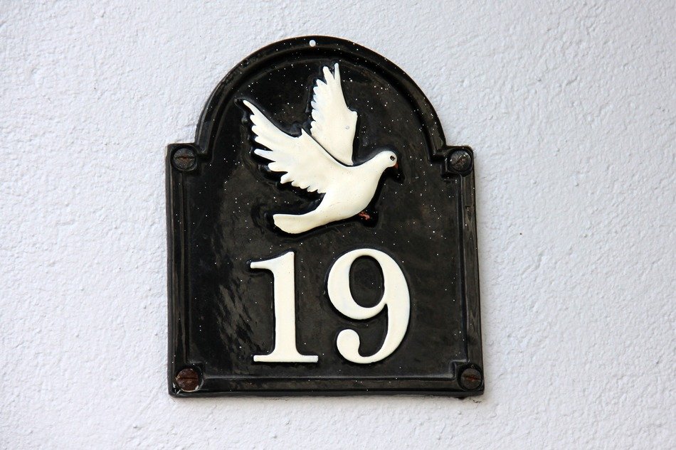house number 19 with a dove