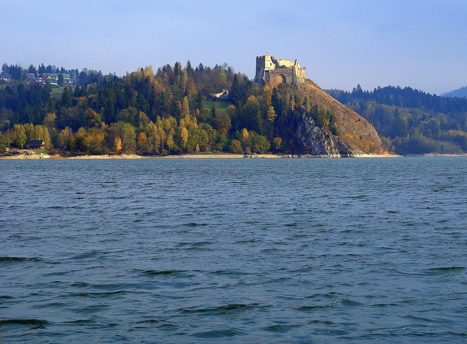 distant view of the castle Chorsztyn Castle on the lake