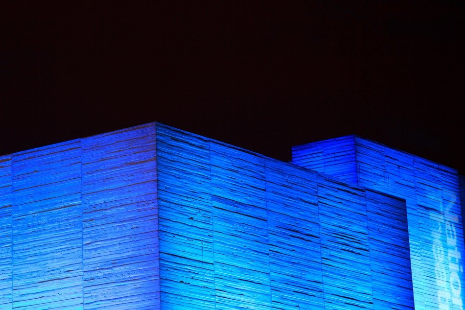 concrete building with blue light
