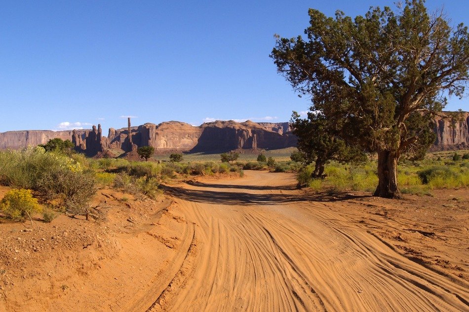 dusty road to the monument valley