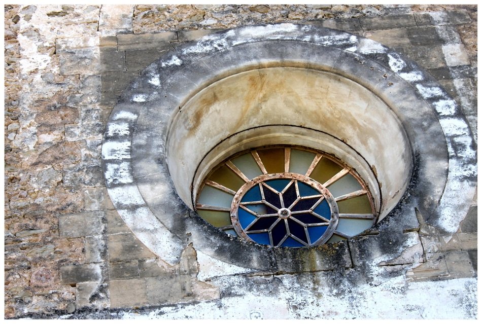 Colorful round stained glass window of the church
