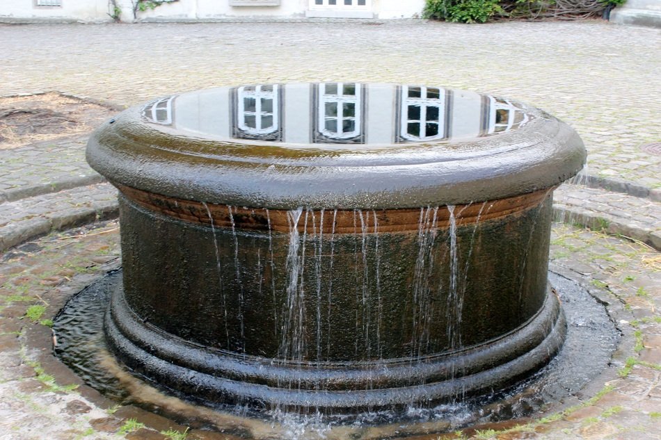 round fountain near the castle