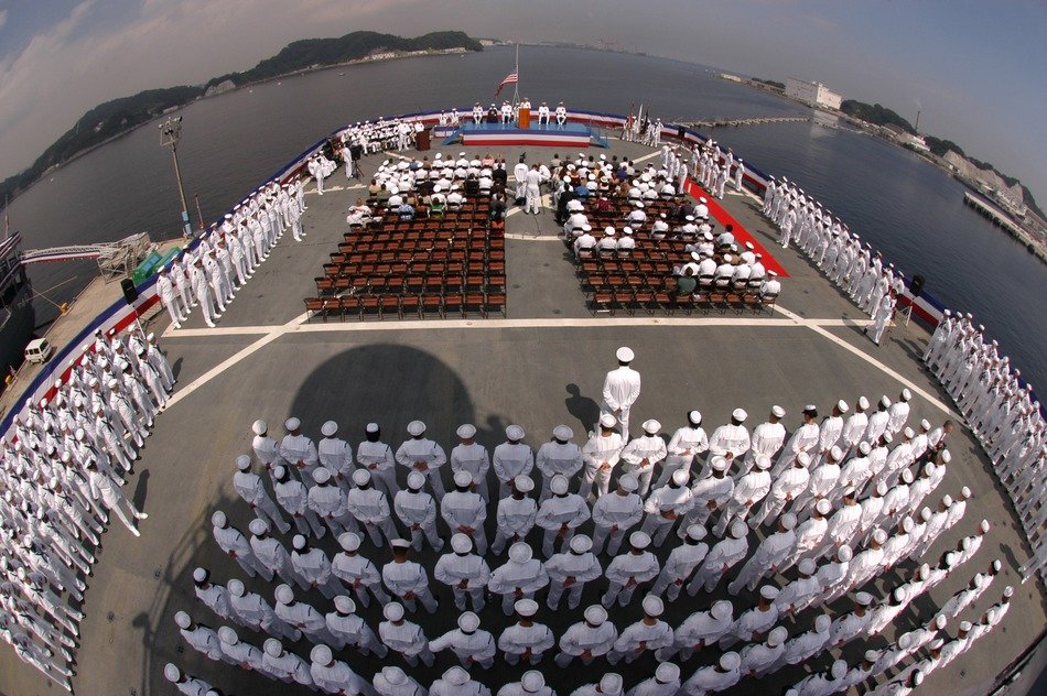 solemn parade of sailors on an aircraft carrier on the shore of Yokosuka, Japan