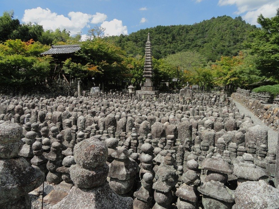 Stone figures in the forest of Sagano in Japan