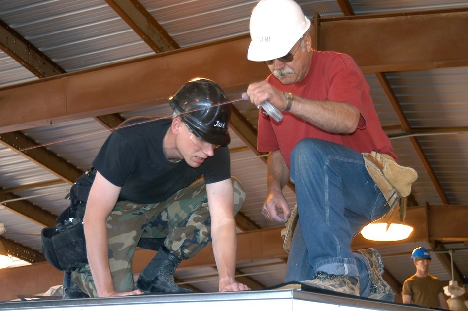 Workers in hard hats at construction site