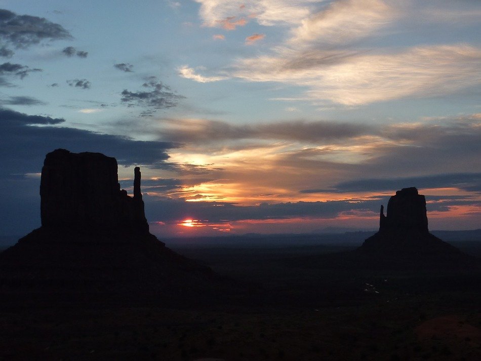 silhouettes of rocky towers in the valley of monuments at dawn