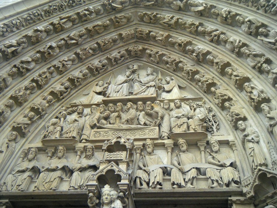 embossed figures on the tower