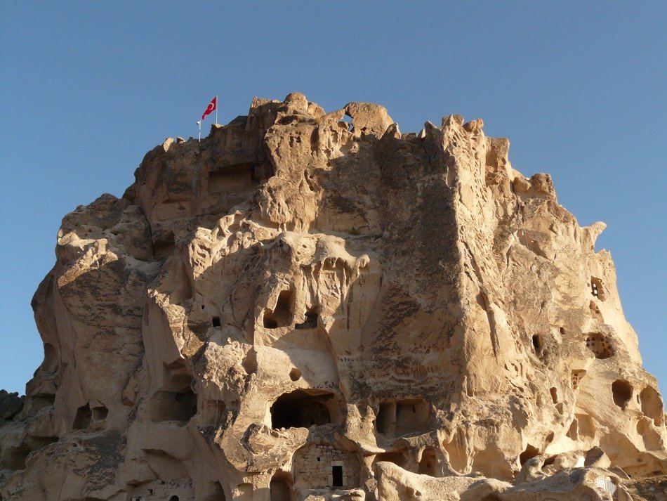 Stone houses in Uchisar against the sky