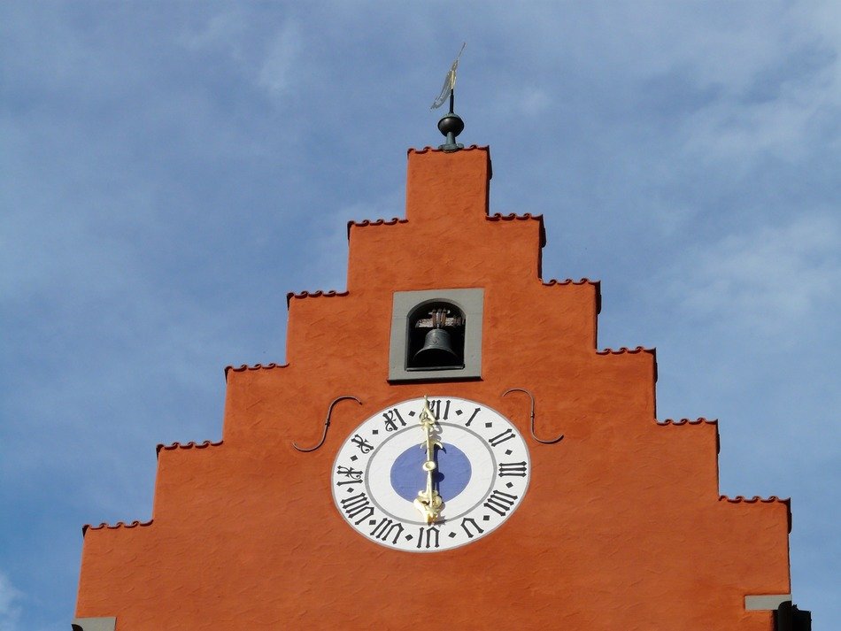 clock and bell at the gate of the tower in Meersburg
