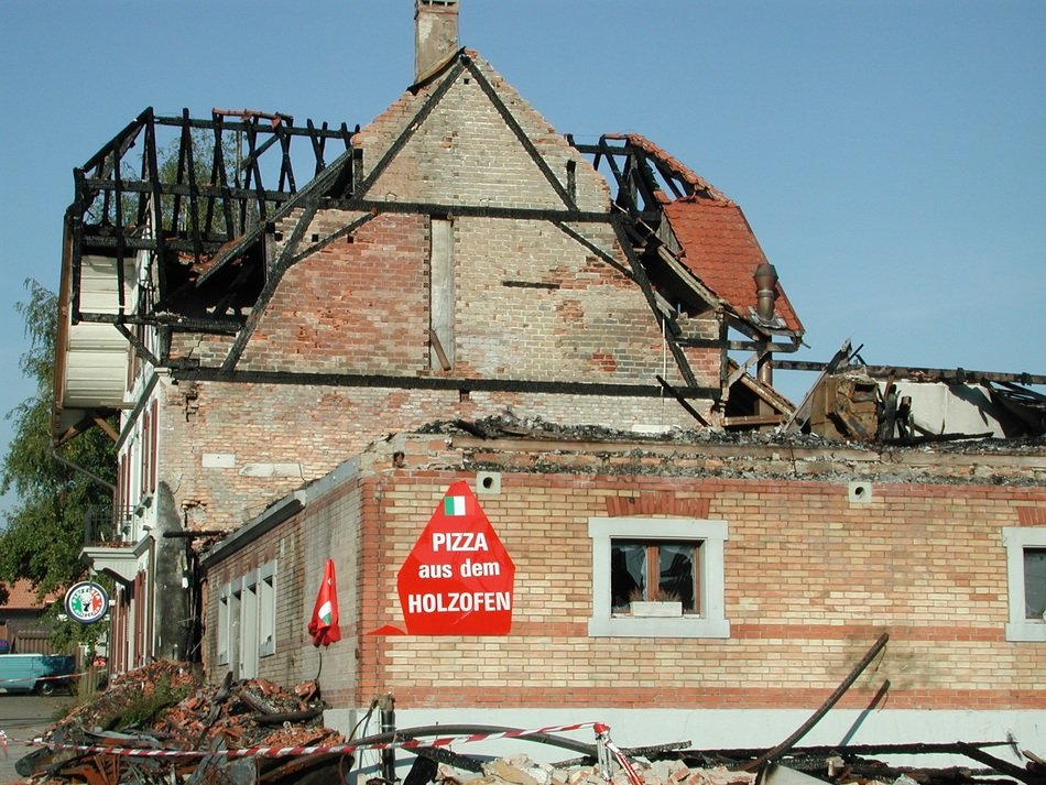 burned down home of a pizzerias
