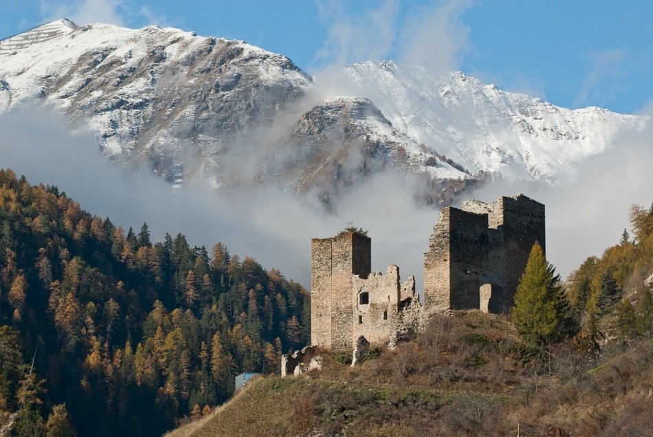 alpine landscape with TschanÃ¼ff Castle ruins, switzerland