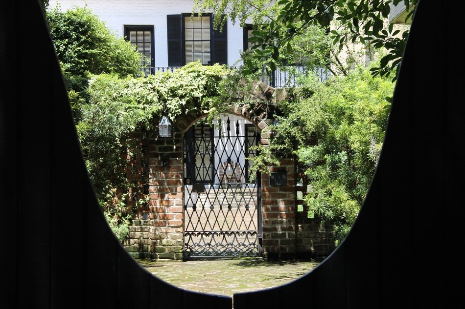 view through the keyhole to the garden gate