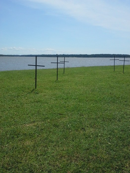Memorial grave markers on a james river bank, usa, virginia, jamestown
