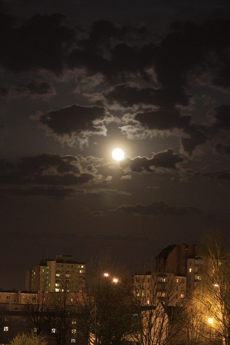 moon in the clouds over night osiedle