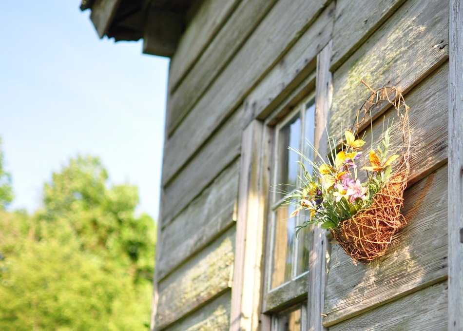 Basket of flowers on a wood house