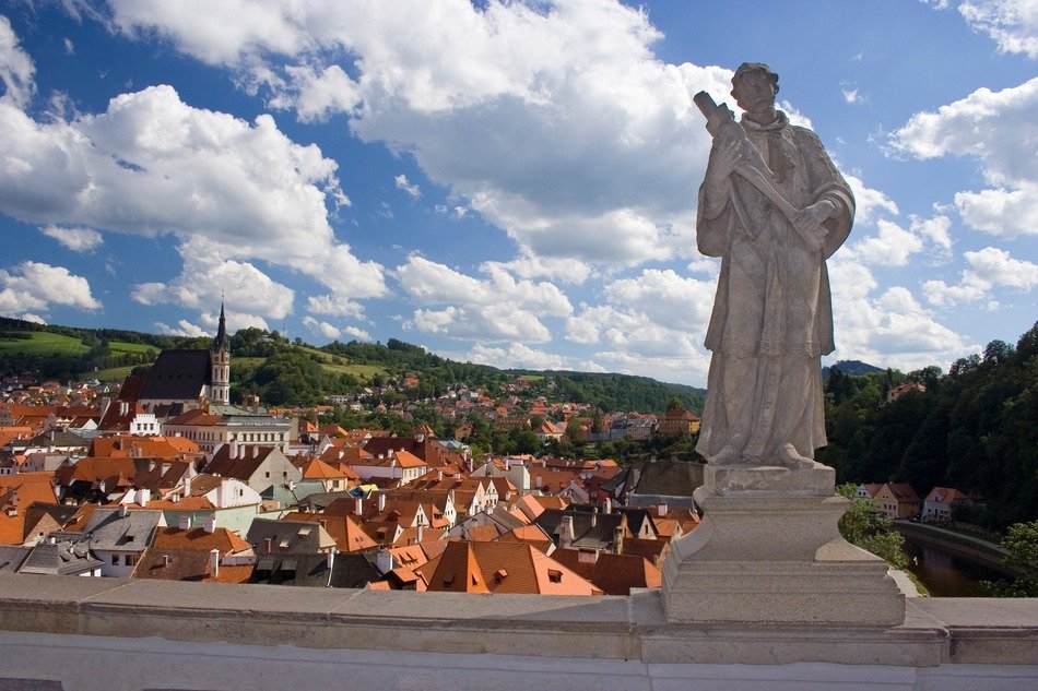 Statue of a fairy above a city in the Czech Republic