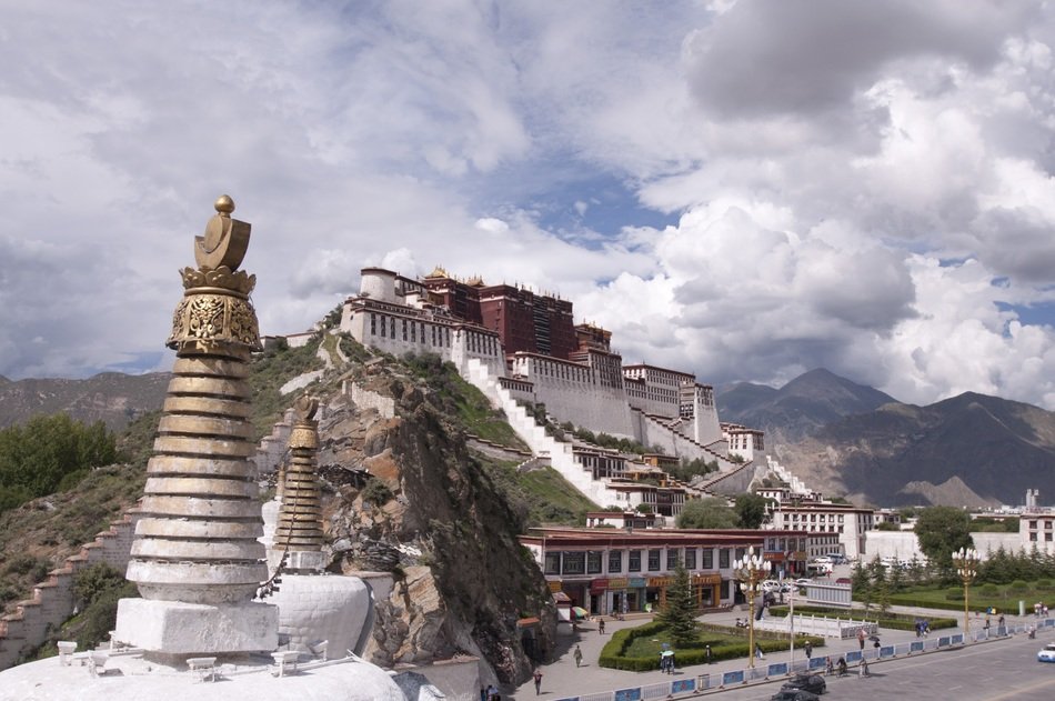palace in tibet under a cloudy sky