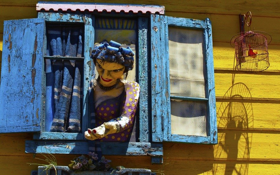 sculpture of woman in the window