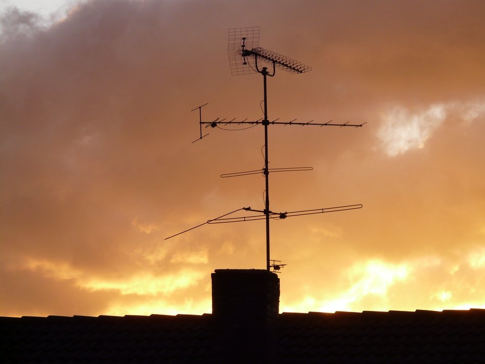 roof antenna on the background of clouds