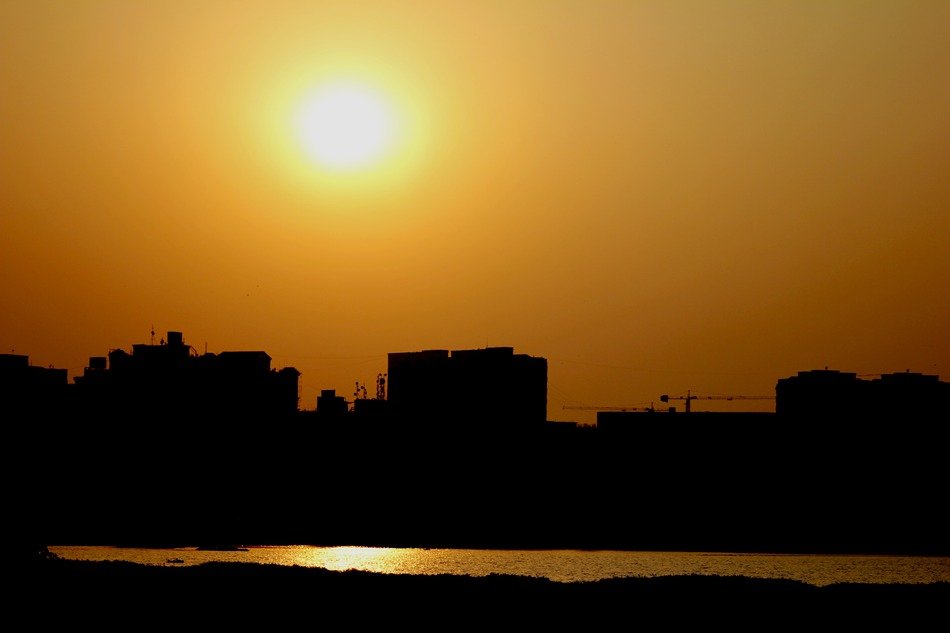 View of the sunrise,water and the buildings