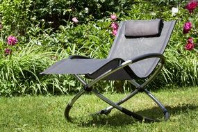 new grey deck chair in garden