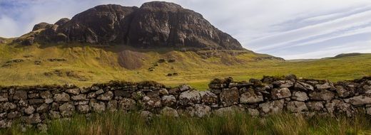 landscape of amazing mountain stone fence in front