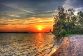 Golden sunset over the lake in the country