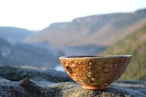 Ceramic bowl on the stone