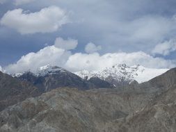landscape of white clouds over the peaks of the mountains