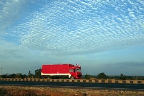 Red truck on the road in india