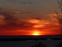 red sunset in the clouds over nature