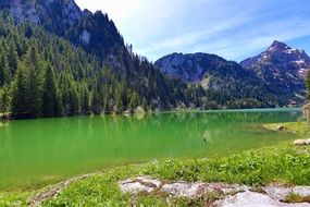 green lake mountains green forest