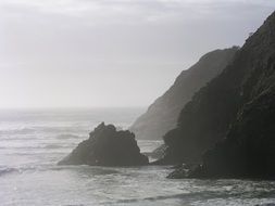 panoramic view of rocky pacific coast in oregon in bright sunshine