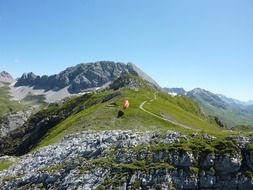 Paragliding over a green mountain