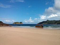 red boat on empty beach, china, sai kung