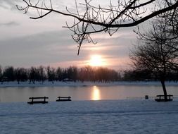 tranquil sunset in the snowy park