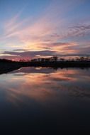beautiful sunset reflected in the water in oklahoma