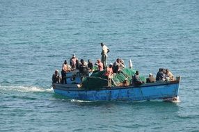 many fishermen in one boat in Africa