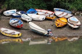 Colorful rowing boats near the water