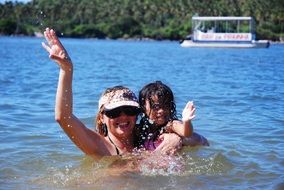 mother and daughter beach