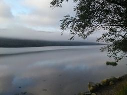 lake at dawn in the mist